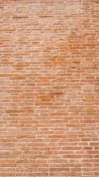 An old wall made of mud bricks in various shades of brown Stock Photos
