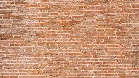 An old wall made of mud bricks in various shades of brown Stock Photos