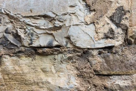 Old wall masonry with different sizes smeared joints Stock Photos