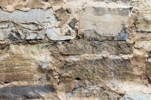 Old wall masonry with different sizes smeared joints Stock Photos