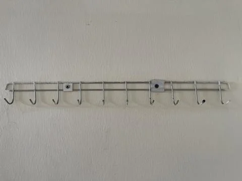 Old Wall Mounted Metal Hook Rack Close Up Stock Photos