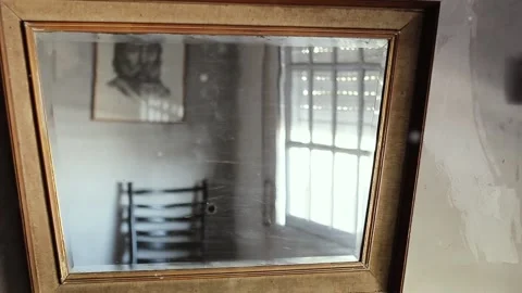 An Old Wall-Mounted Mirror in House Room with Floating Particles in the Air. Stock Footage 108572972