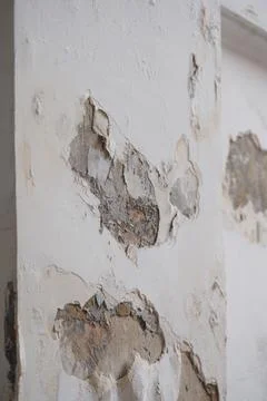 Old wall with peeling paint in a building Stock Photos