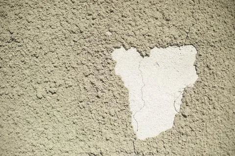 Old wall. Plaster crumbled from wall. Poor coverage. Stock Photos