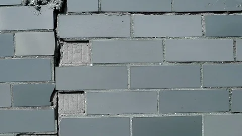 Old wall of rectangular tiles in wide gray shades Stock Footage 124027635