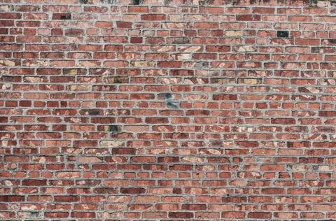 Old wall red bricks, rough masonry with concrete seams, rough surface, retro  Stock Photos