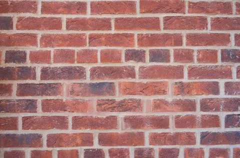 Old wall of red briks tiled background, regular block texture. Wallpaper of o Stock Photos