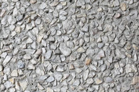 Old wall of small pebbles Stock Photos