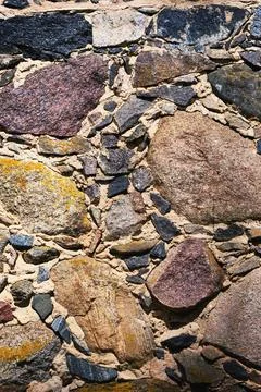 Old wall of stone shell rock of arbitrary shape. Stock Photos