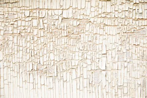 Old wall texture with vertical peeling white paint background. Close-up 스톡 사진