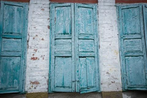 Old wall with three windows Stock Photos