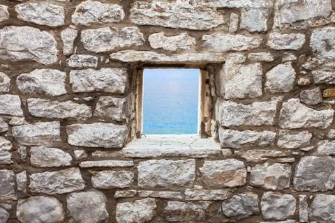 Old wall with window seaview Stock Photos