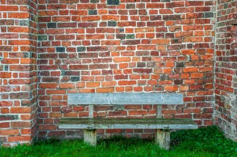 Old wall wtih a bench. Stock Photos