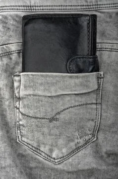 Old wallet in old jeans Stock Photos