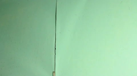 Old wallpaper removal do-it-yourself redecorating using a hand scraper. Video stock 53019812