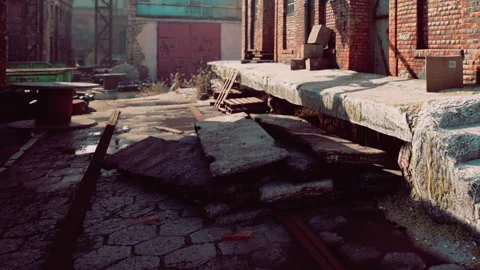 Old warehouse area with broken ground and scattered items near tracks Stock Footage 344142624