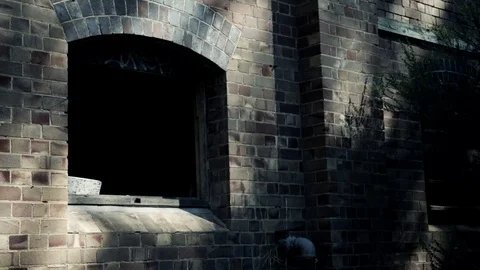 Old warehouse dolly slider shot of dark window Video stock 81464985