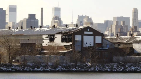 Old warehouse on river with large hole from storm or accident Stock Footage 31816666