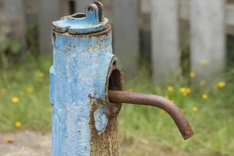 Old water column.Old rusty water column in the village.Alternative in the abs Stock Photos