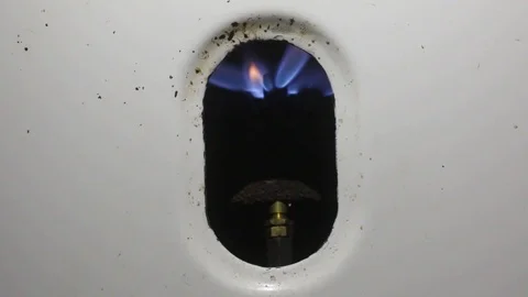 Old water heater ignites and the flame grows Stock Footage 123799541