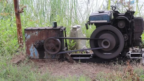 Old water machine pump working by belt to driving water turbine Stock Footage 155603196