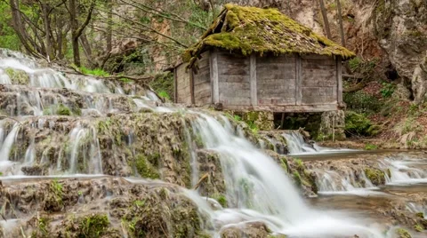 Old water mill and forest waterfalls on mountain river. Easy zoom in Stock Footage 62970341