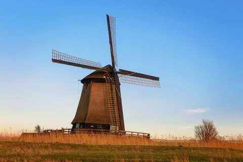 Old water mill beside Eilandspolder in evening light, the Netherlands Stock Photos
