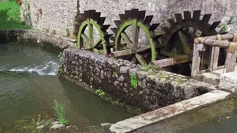 Old water mill still working. Wooden wheels of old mill are rotating. Slovenia. 스톡 동영상 72181723