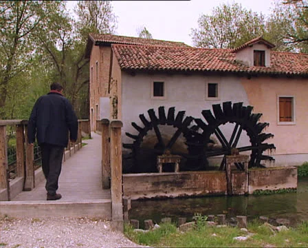 OLD WATERMILL and man passing by Video stock 24002835