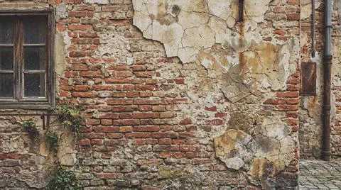 Old weathered brick wall with window. Fotos Stock