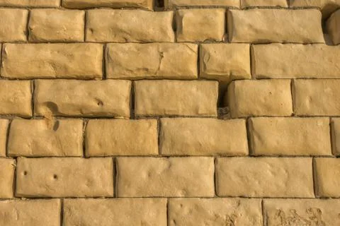 Old weathered brown wall limestone background in Malta, close up 写真素材