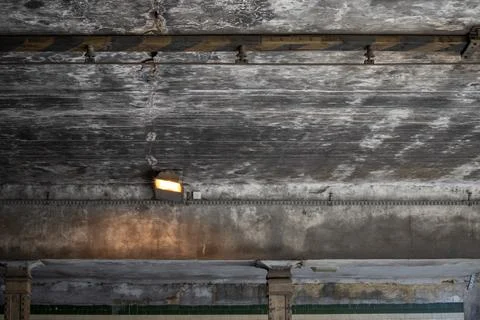 Old weathered concrete ceiling with visible cracks, stains, and peeling paint Stock Photos