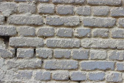 Old weathered gray brick wall vintage style background Stockfoto's