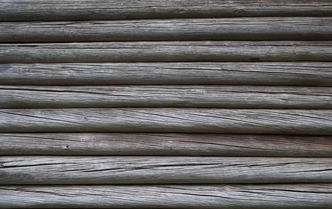 Old weathered gray log wall Stock Photos