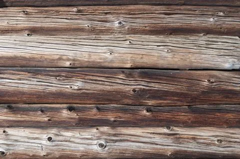 Old weathered log wall background Stock Photos