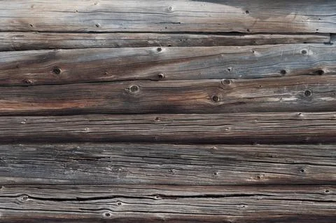 Old weathered log wall background Stock Photos