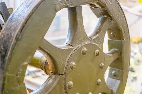 Old, weathered metallic structure resembling a mechanical wheel or industri.. Stock Photos