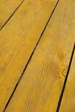 Old weathered pine boards being yellow painted Stock Photos