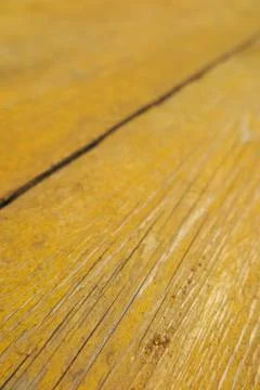 Old weathered pine boards being yellow painted Stock-Fotos