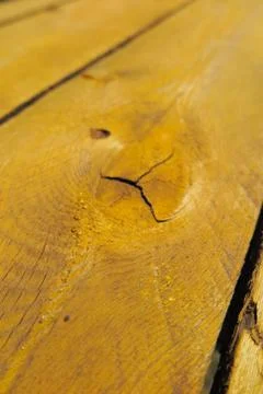 Old weathered pine boards being yellow painted Stock Photos