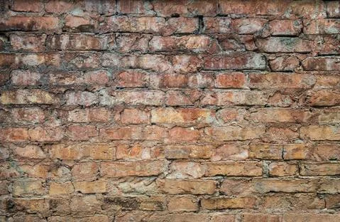 Old weathered red Brick wall. Vintage texture Background. Stock Photos