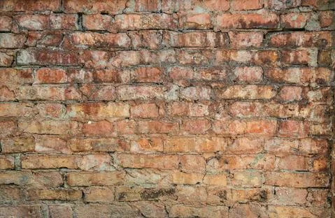 Old weathered red Brick wall. Vintage texture Background. Photos