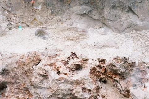 Old weathered rock wall, pattern and texture, colorful background Stock Photos