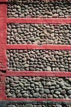 Old weathered stone wall as background . Vertical shot Stock Photos
