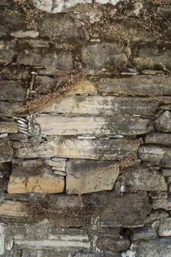 Old weathered stone wall texture or background Stock Photos