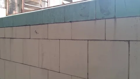 Old weathered wall tiles panning across a rustic vintage interior Stock Footage 345362174