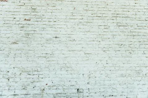 Old weathered white brick wall. Vintage texture Background. Stock Photos