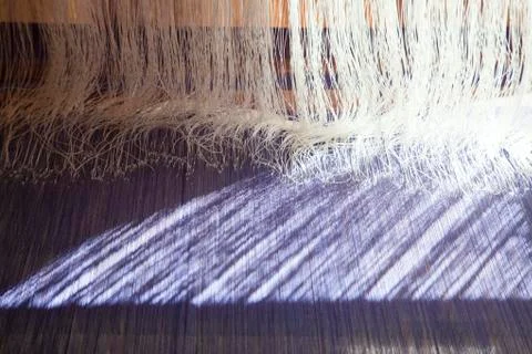 Old weaving Loom and thread of yarn. Stock Photos