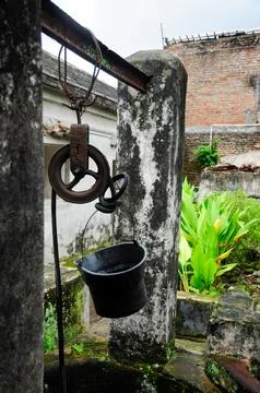 Old well with bucket Stock Photos
