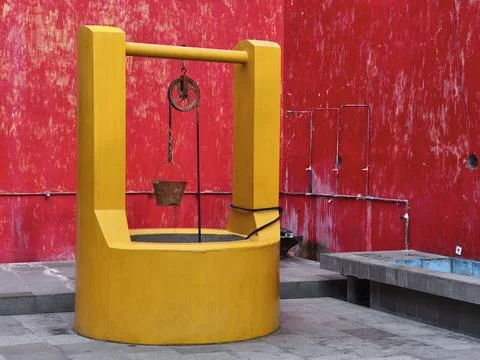 An old well water source inside the Red House Stock Photos
